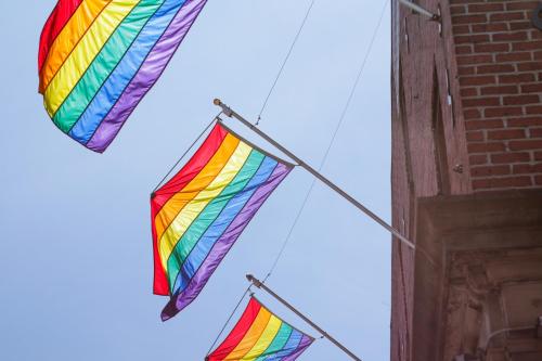 a colorful kite flying in the sky next to a building at PVT Hostel in Montréal