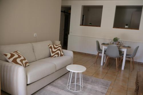 Posezení v ubytování Au cœur de Neuville Appartement 4 pers RDC