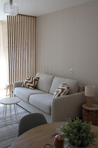 Posezení v ubytování Au cœur de Neuville Appartement 4 pers RDC