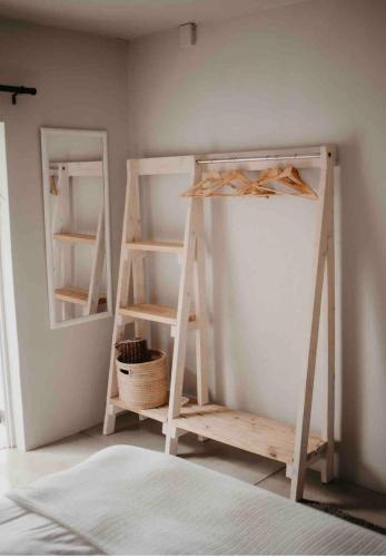 a room with two bunk beds and a mirror at Clanwilliam Dam House in Clanwilliam