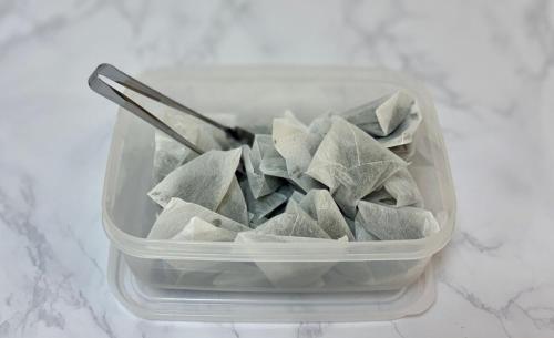 a plastic container filled with wontons sitting on a counter at ZenAbode, 5-minute walk from Taiko-dori Station, 1-minute train ride from Nagoya Station, excellent location for sightseeing in Nagoya in Nagoya