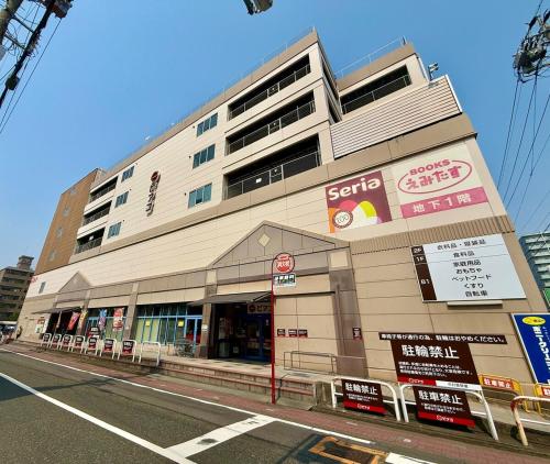 a building on the side of a street at ZenAbode, 5-minute walk from Taiko-dori Station, 1-minute train ride from Nagoya Station, excellent location for sightseeing in Nagoya in Nagoya