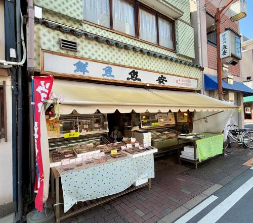 a food stand on the side of a building at ZenAbode, 5-minute walk from Taiko-dori Station, 1-minute train ride from Nagoya Station, excellent location for sightseeing in Nagoya in Nagoya
