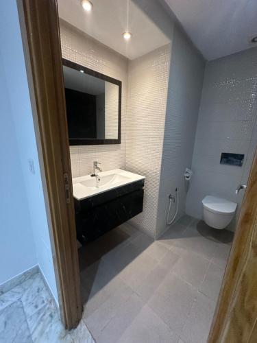 a bathroom with a sink and a toilet at Luxury suite jardin de Carthage in Sidi Daoud
