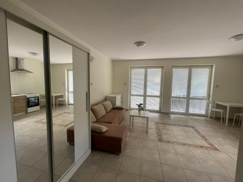 a living room with a couch and a table at Apartamenty Bolszewo in Bolszewo