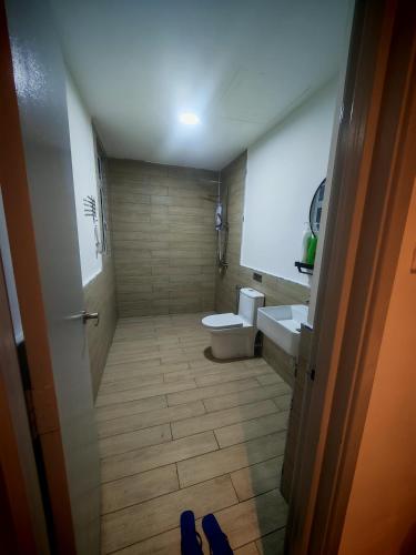 a bathroom with a toilet and a sink at AZ Mahkota Valley Suites studio in Kuantan