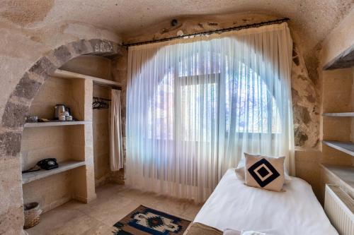 Carmin Cave Hotelにあるベッド