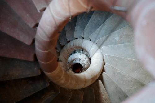 a spiral staircase in a building at Hôtel & Spa Le Bouclier D'or in Strasbourg