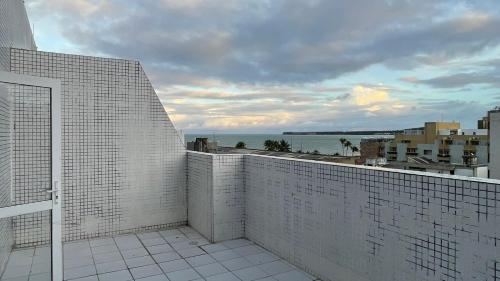 a balcony with a view of the ocean at Apto 515 - Seu Refúgio na Praia - Nobile Hotel in João Pessoa
