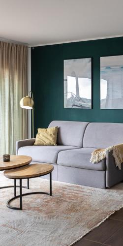 a living room with a couch and a table at maresoul - Ferienapartment soul in Raposeira