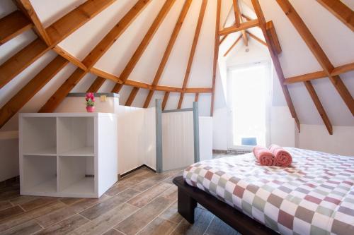 a bedroom with a bed in a attic at Milin Avel I 6 personnes & plage in Crozon