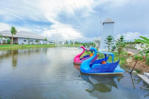 two inflatable boats in a body of water at The Memory Luxury Resort in Haad Chao Samran