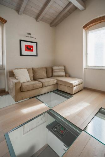 a living room with a couch and a glass table at Doria Park Hotel in Lerici