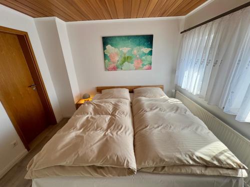 Postel nebo postele na pokoji v ubytování Sakura House Celle