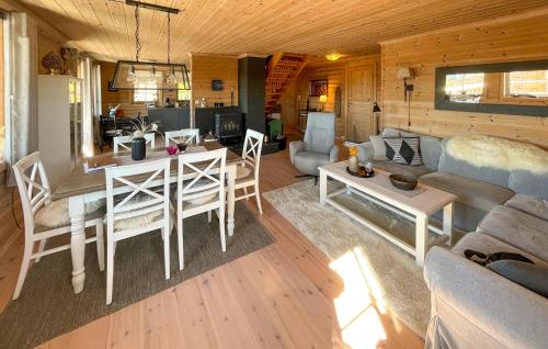 a living room with a couch and a table at 3 Bedroom Gorgeous Home In Treungen in Treungen