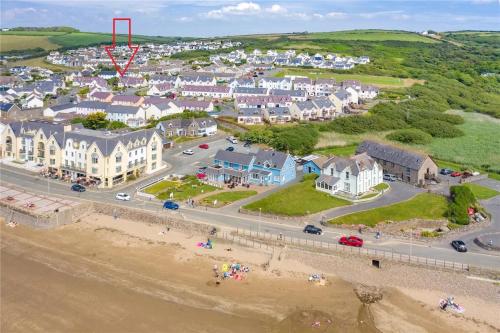an aerial view of a town with a beach and houses at Family friendly house 200 meters to beach in Broad Haven