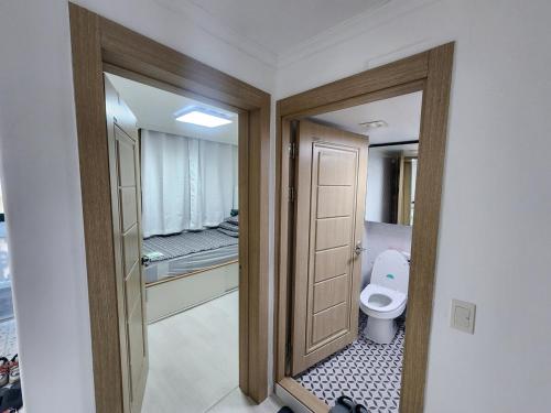 a bathroom with a toilet in a room at Stay JAYU in Daejeon