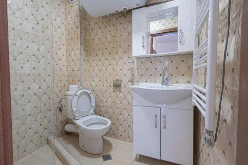 a bathroom with a toilet and a sink at Sea Garden Marina 3 in Varna City
