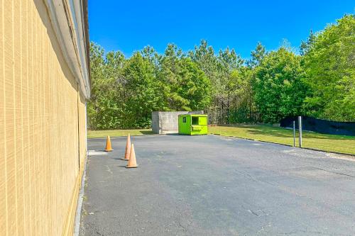 a parking lot with orange cones in front of a building at OYO Hotel Jonesboro Near Atlanta Airport in Jonesboro