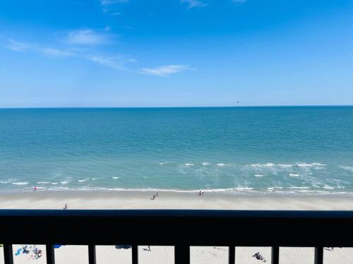 a view of the beach from a balcony at Updated Oceanfront Pools & More S129 in Myrtle Beach