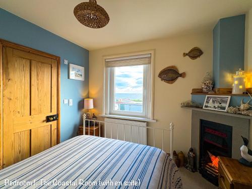 a bedroom with a bed and a window at BillWatch Cottage in Southwell