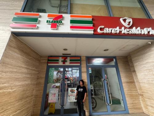a man standing in front of a car dealership at GRAND RIEVERA SUiTES in Manila