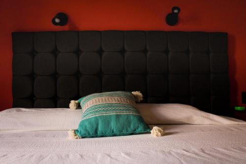 a teddy bear laying on top of a bed at Lidia Anturios Suites in Oaxaca City