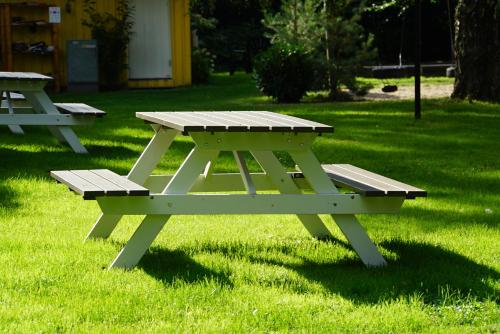 a picnic table in the grass in a park at Ystad Holiday Houses in Ystad