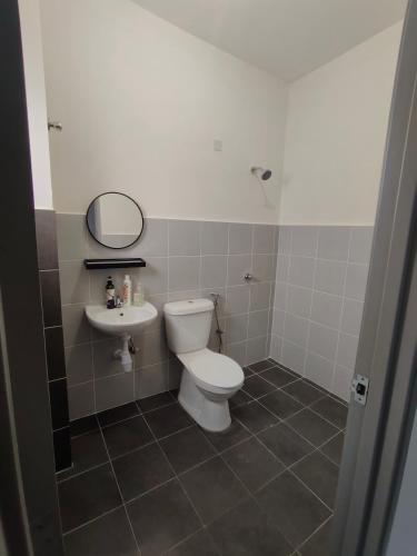 a bathroom with a toilet and a sink at Homestay 641 Mu5lim only in Port Dickson