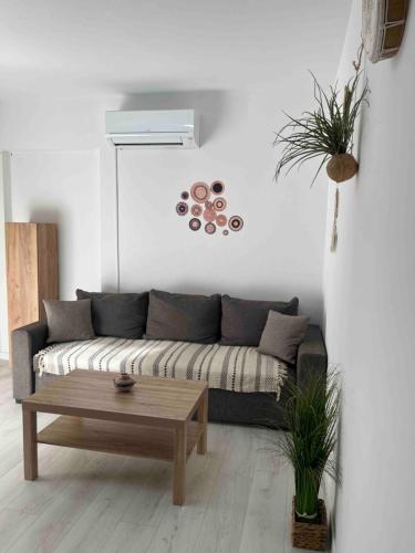 a living room with a couch and a coffee table at Casa Del Mar in Mali Lošinj