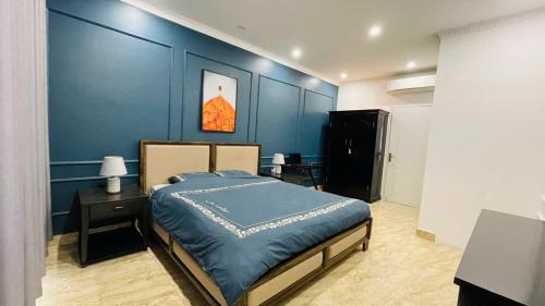 Ένα ή περισσότερα κρεβάτια σε δωμάτιο στο Gau House