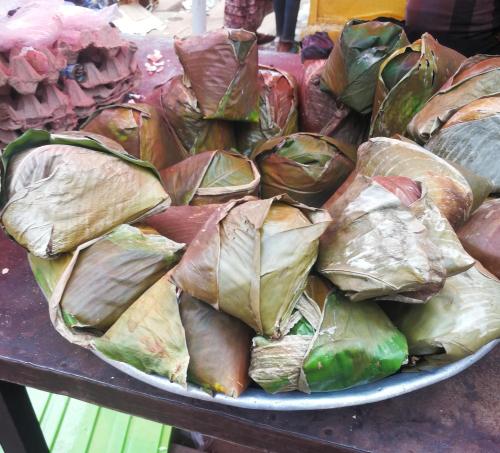 a pile of wrapped food on a plate on a table at The Best Powerful Spiritual Herbalist Man In Nigeria in Ijebu Igbo