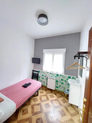 Letto o letti in una camera di Pensión El Pozo