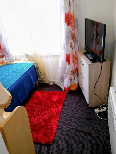 Телевизор и/или развлекательный центр в Maison Alfort Guest
