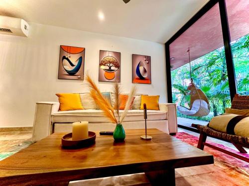 a living room with a couch and a table at Caribbean soul in Tulum