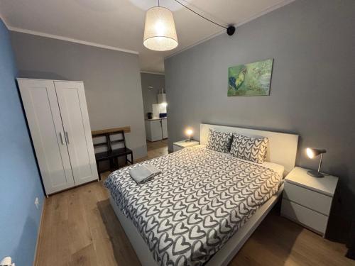 Postel nebo postele na pokoji v ubytování Holdek Apartamenty Francuska