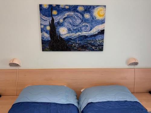 A bed or beds in a room at Hotel Villa Augusta