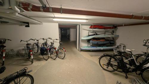 a group of bikes parked in a garage at Turm-Penthouse Heiligenhafen in Heiligenhafen
