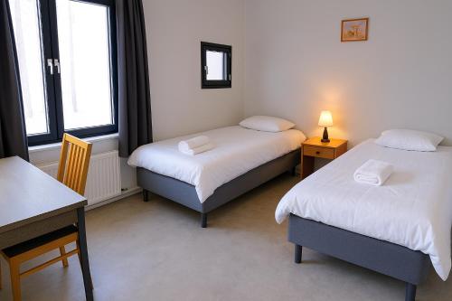 Ένα ή περισσότερα κρεβάτια σε δωμάτιο στο Nordic Inn