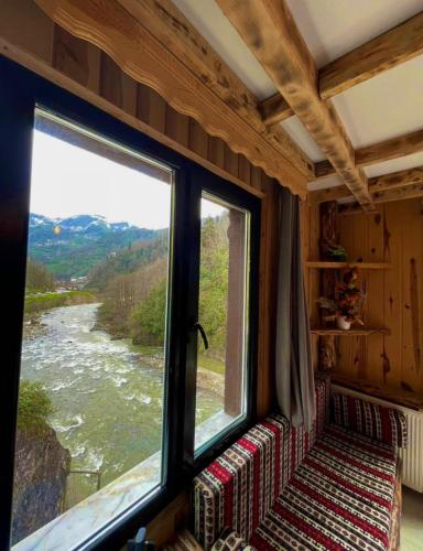 a window in a room with a view of a river at VALLEY SUiT OTEL in Rize