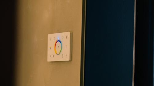 a lightswitch on a wall next to a door at Regina Elena Suites & Private SPA in Sannicola