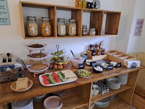 a table with many different types of food on it at WuhrsteinHaus, Heil- und Seminarzentrum Chiemgau in Schleching