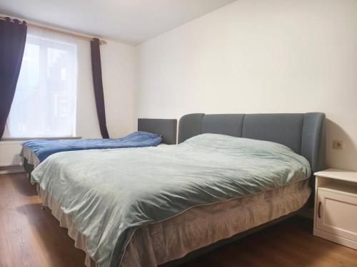 Ένα ή περισσότερα κρεβάτια σε δωμάτιο στο La Maison Heureuse