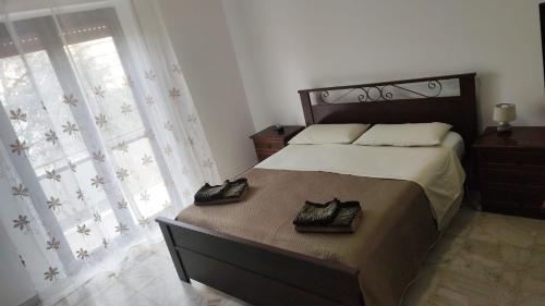 Postel nebo postele na pokoji v ubytování Reggio'S House