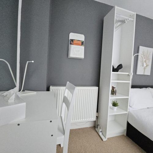 En eller flere senge i et værelse på Comfy rooms in Central London