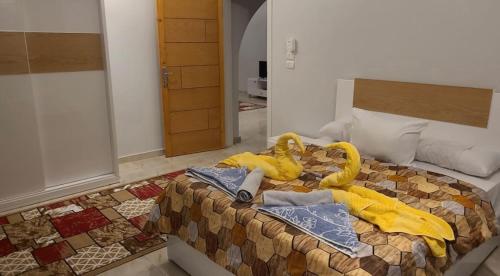 Katil atau katil-katil dalam bilik di Lemon Tree apartments luxor