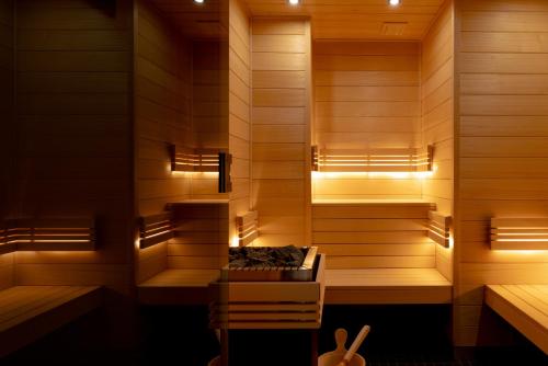 a sauna with a bench in the middle at Bizipoz Hôtel in Saint-Jean-de-Luz