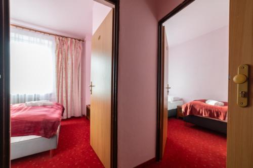 Postel nebo postele na pokoji v ubytování Żegiestów 35