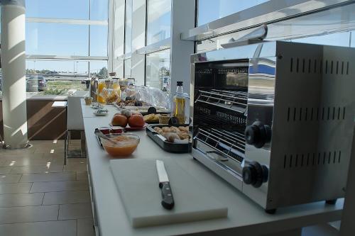 a kitchen with a counter with food on it at Hotel AS Torrent in Torrent