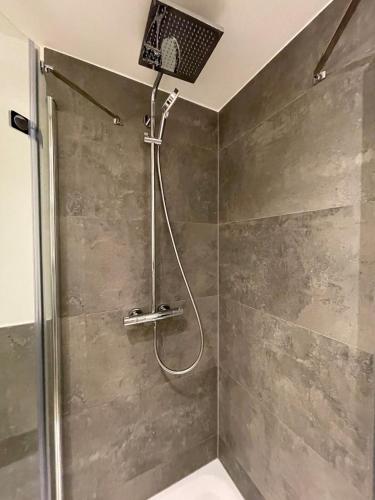 a shower with a shower head in a bathroom at Stylishes & neues Premium-Loft in Tönisvorst